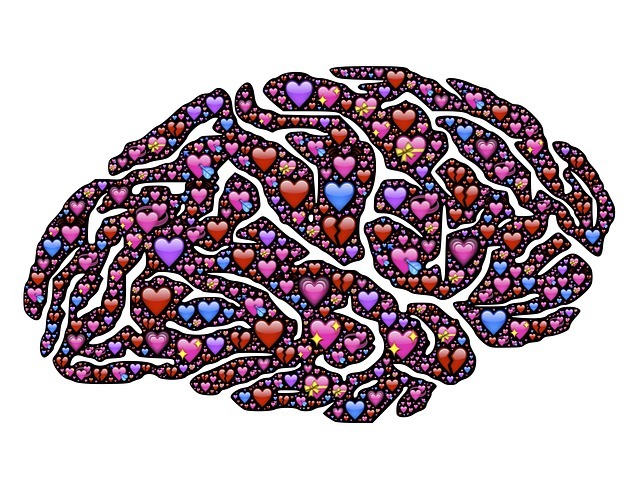 An illustration of hundreds of small heart forming the shape of a brain. An illustration of hundreds of small heart forming the shape of a brain.